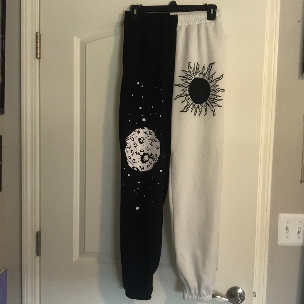Black and white split sun and moon sweatpants